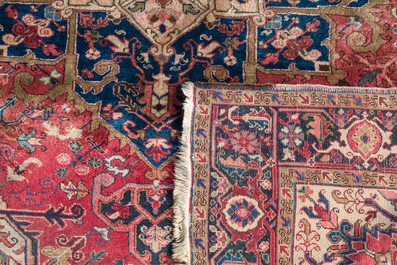 A Persian Heriz rug with floral design, wool on cotton, first half 20th C.