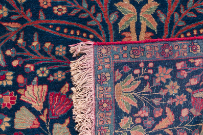 A pair of Persian Kerman (Kirman) rugs with floral design, wool on cotton, 20th C.