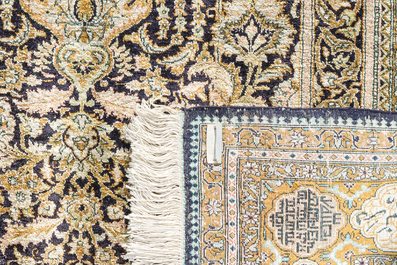 A Persian Qom (Qum/Ghom) silk rug with floral design and calligraphy, Mahneb, third quarter 20th C.