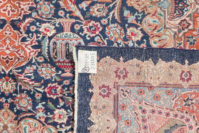 A Persian Kashmar rug with floral design, wool on cotton, 20th C.
