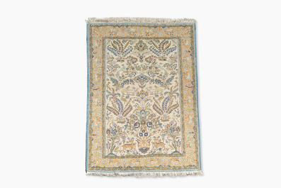 A Persian Qom (Qum/Ghom) rug with floral design, silk on cotton, 20th C.