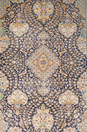 A Persian Kashmir rug with floral design, wool on cotton, 20th C.