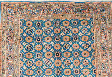 A Persian Varamin rug with floral design, wool on cotton, 20th C.