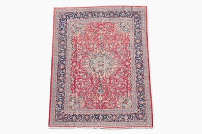 A Persian Keshan (Kashan) rug with floral design, wool on cotton, 20th C.