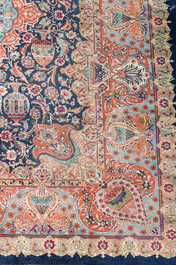 A Persian Kashmar rug with floral design, wool on cotton, 20th C.