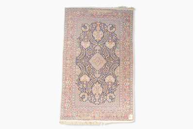 A Persian Kashmir rug with floral design, wool on cotton, 20th C.