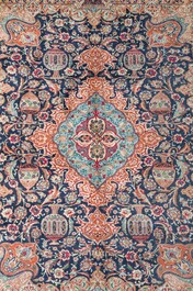 A Persian Kashmar rug with floral design, wool on cotton, 20th C.