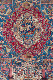 Een Perzisch Kashmar tapijt met antiquiteiten en floraal decor, gesigneerd Taji, wol op katoen, 20ste eeuw