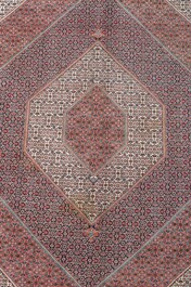 A Persian Bidjar rug with floral design, wool on cotton, 20th C.