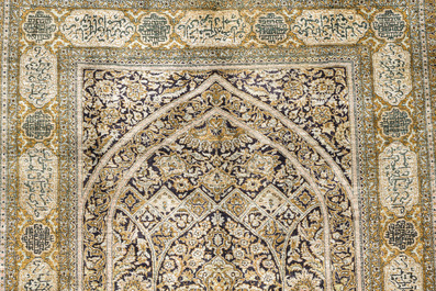 A Persian Qom (Qum/Ghom) silk rug with floral design and calligraphy, Mahneb, third quarter 20th C.