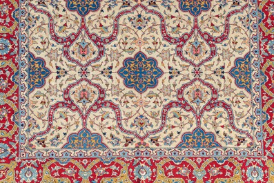 A Persian Tehran rug with floral design, wool on cotton, 20th C.