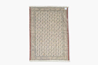 A Turkmen rug with geometric design, wool on cotton, 20th C.