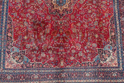 A Persian Bidjar rug with floral design, wool on cotton, 20th C.