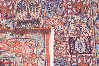 Two Persian Bakhtiar rugs with floral design, wool on cotton, 20th C.