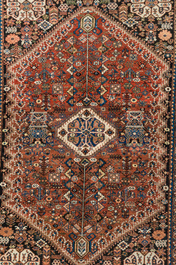 Two Persian and one Afghan rug with geometric design, wool on cotton, 20th C.