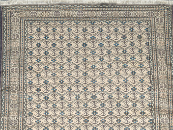 A Turkmen rug with geometric design, wool on cotton, 20th C.