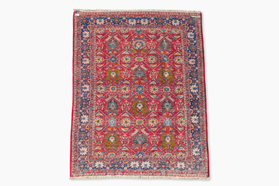 A Persian Varamin rug with floral design, wool on cotton, 20th C.