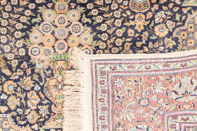 A Persian Kashmir rug with floral design, wool on cotton, 20th C.
