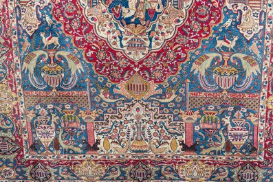 Een Perzisch Kashmar tapijt met antiquiteiten en floraal decor, gesigneerd Taji, wol op katoen, 20ste eeuw