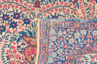 A Persian Kerman (Kirman) rug with floral design, wool on cotton, first half 20th C.