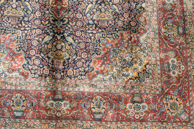 A presumably Indian Qom (Qum/Ghom) rug with floral design, wool on cotton, 20th C.