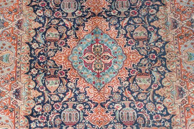 A Persian Kashmar rug with floral design, wool on cotton, 20th C.