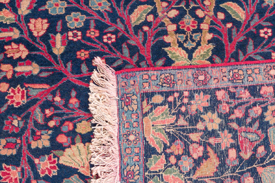 A pair of Persian Kerman (Kirman) rugs with floral design, wool on cotton, 20th C.