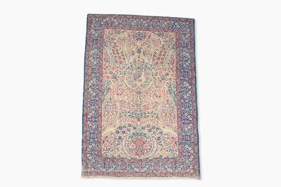 A Persian Kerman (Kirman) rug with floral design, wool on cotton, first half 20th C.