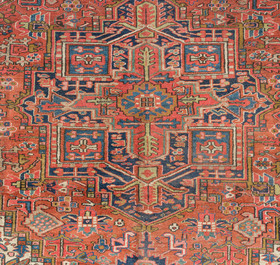 A Persian Heriz rug with floral design, wool on cotton, 20th C.