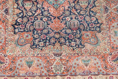 A Persian Kashmar rug with floral design, wool on cotton, 20th C.
