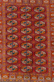Two Persian and one Afghan rug with geometric design, wool on cotton, 20th C.