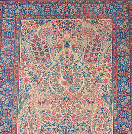 A Persian Kerman (Kirman) rug with floral design, wool on cotton, first half 20th C.