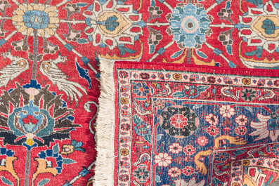 A Persian Varamin rug with floral design, wool on cotton, 20th C.