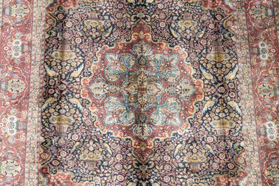 A presumably Indian Qom (Qum/Ghom) rug with floral design, wool on cotton, 20th C.