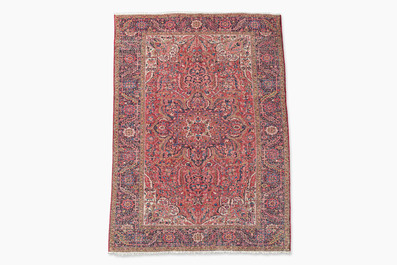 Een Perzisch Heriz tapijt met floraal decor, wol op katoen, 20ste eeuw