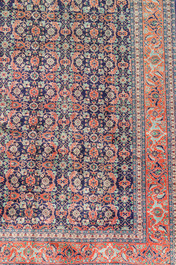 A Persian Tabriz rug with floral design, wool on cotton, 20th C.