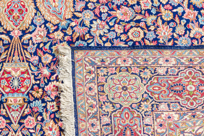 A Persian Kerman (Kirman) rug with floral design, wool on cotton, 20th C.