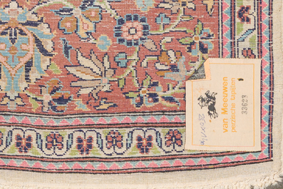 A Persian Kashmir rug with floral design, wool on cotton, 20th C.