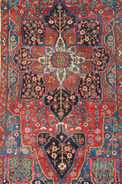 A Persian Bakhtiar rug with floral design, wool on cotton, 20th C.