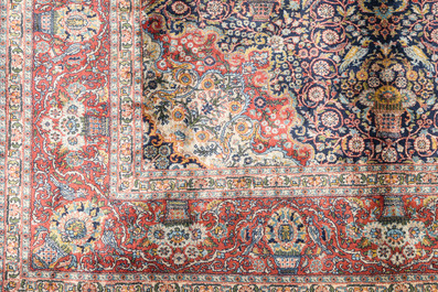A presumably Indian Qom (Qum/Ghom) rug with floral design, wool on cotton, 20th C.