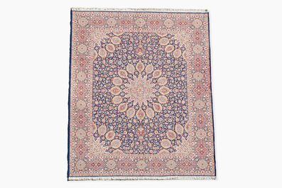 A Persian Kerman (Kirman) rug with floral design, wool on cotton, 20th C.