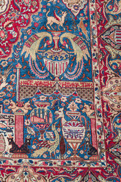 Een Perzisch Kashmar tapijt met antiquiteiten en floraal decor, gesigneerd Taji, wol op katoen, 20ste eeuw