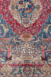 Een Perzisch Kashmar tapijt met antiquiteiten en floraal decor, gesigneerd Taji, wol op katoen, 20ste eeuw