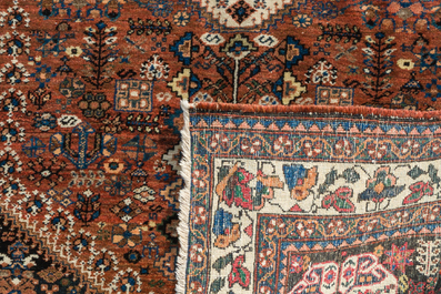 Two Persian and one Afghan rug with geometric design, wool on cotton, 20th C.