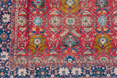 A Persian Varamin rug with floral design, wool on cotton, 20th C.