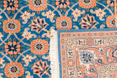 A Persian Varamin rug with floral design, wool on cotton, 20th C.