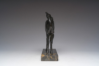 French school: A brown patinated bronze Art Deco sculpture of a doe on a Marmo Portoro marble base, ca. 1920
