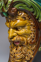 Trois consoles d'appliques en majolique polychrome &agrave; d&eacute;cor d'une sir&egrave;ne, d'un mascaron et d'un blason, une marqu&eacute;e Sarreguemines, France, d&eacute;but 20&egrave;me