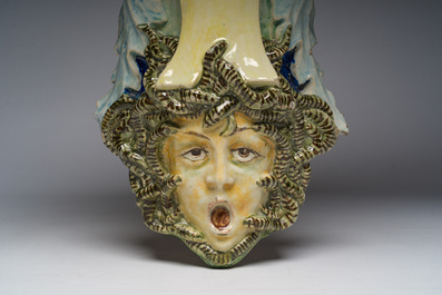 Trois consoles d'appliques en majolique polychrome &agrave; d&eacute;cor d'une sir&egrave;ne, d'un mascaron et d'un blason, une marqu&eacute;e Sarreguemines, France, d&eacute;but 20&egrave;me