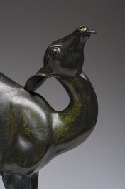 French school: A brown patinated bronze Art Deco sculpture of a doe on a Marmo Portoro marble base, ca. 1920